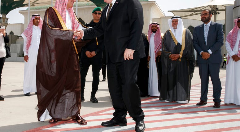 Secretary of State Mike Pompeo, center, shakes hands with Saudi Minister of State for Foreign Affairs Adel al Jubeir, as Pompeo departs Jeddah, Saudi Arabia, Monday, June 24, 2019, en route to Abu Dhabi. (AP Photo/Jacquelyn Martin, Pool)