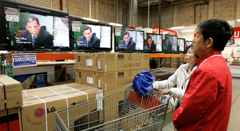 FILE - In this Feb. 22, 2009, file photo shoppers watch the television show "The Office" as they compare wide screens on display at Costco in Mountain View, Calif. (AP Photo/Paul Sakuma, File) FILE - In this Feb. 22, 2009, file photo shoppers watch the television show "The Office" as they compare wide screens on display at Costco in Mountain View, Calif. (AP Photo/Paul Sakuma, File)