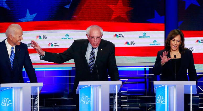 the Democratic primary debate hosted by NBC News at the Adrienne Arsht Center for the Performing Art, Thursday, June 27, 2019, in Miami. (AP Photo/Wilfredo Lee)