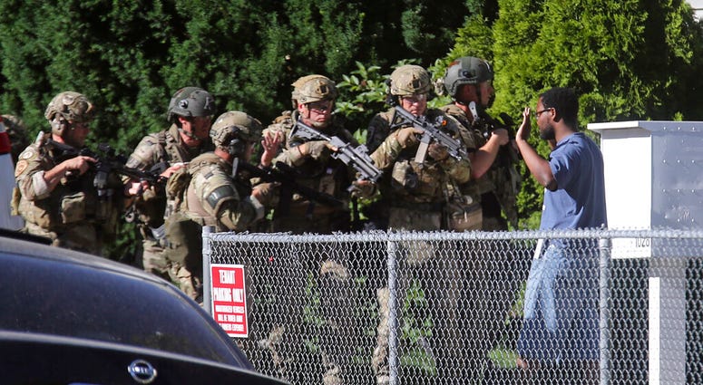 Salt Lake City police take a man into custody in connection with missing University of Utah student MacKenzie Lueck in Salt Lake City on Friday, June 28, 2019. Salt Lake City police said the man was brought in Friday morning, but did not immediately provi