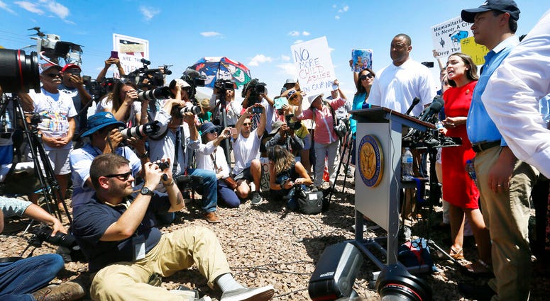 U.S. Rep. Alexandria Ocasio-Cortez, D-New York, talks about what she saw on her tour of area border facilities Monday, July 1, at the Border Patrol station in Clint. Ocasio-Cortez was attempting to talk over the protesters. (Briana Sanchez / El Paso Times