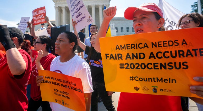 In this June 27, 2019, file photo, Demonstrators gather at the Supreme Court as the justices finish the term. (AP Photo/J. Scott Applewhite, File)