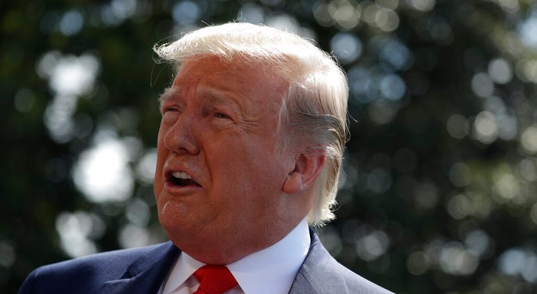 President Donald Trump talks to reporters on the South Lawn of the White House before departing for his Bedminster, N.J. golf club, Friday, July 5, 2019, in Washington. (AP Photo/Evan Vucci)
