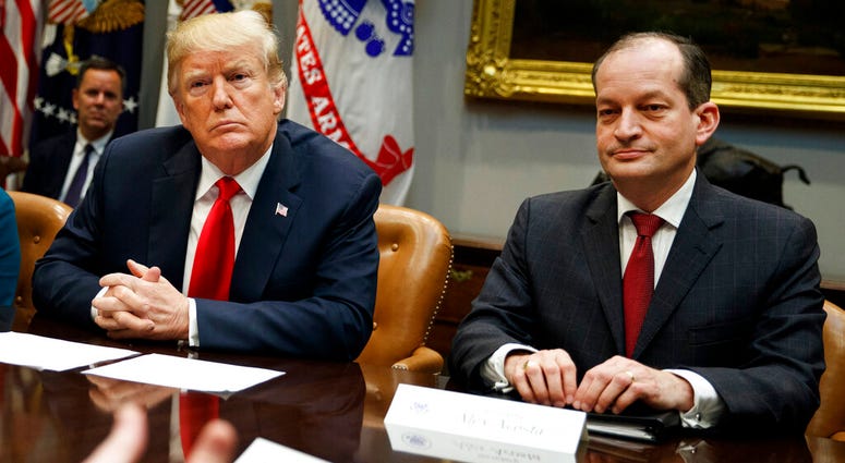 FILE - In this Sept. 17, 2018, file photo, President Donald Trump, left, and Labor Secretary Alexander Acosta listen during a meeting of the President's National Council of the American Worker. (AP Photo/Evan Vucci, File) FILE - In this Sept. 17, 2018, file photo, President Donald Trump, left, and Labor Secretary Alexander Acosta listen during a meeting of the President's National Council of the American Worker. (AP Photo/Evan Vucci, File)