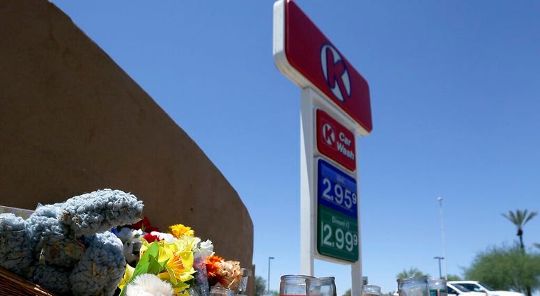 A makeshift memorial for Elijah Al-Amin is set up at a local Circle K store for the death of the stabbing victim Tuesday, July 9, 2019, in Peoria, Ariz. (AP Photo/Ross D. Franklin) A makeshift memorial for Elijah Al-Amin is set up at a local Circle K store for the death of the stabbing victim Tuesday, July 9, 2019, in Peoria, Ariz. (AP Photo/Ross D. Franklin)