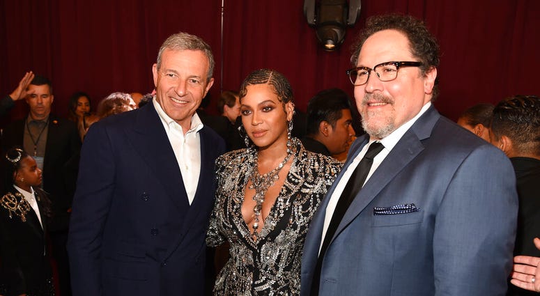 Bob Iger, left, chairman and CEO of The Walt Disney Company, poses with "The Lion King" cast member Beyonce, center, and the film's director Jon Favreau at the premiere of the film. (Photo by Chris Pizzello/Invision/AP) Bob Iger, left, chairman and CEO of The Walt Disney Company, poses with "The Lion King" cast member Beyonce, center, and the film's director Jon Favreau at the premiere of the film. (Photo by Chris Pizzello/Invision/AP)