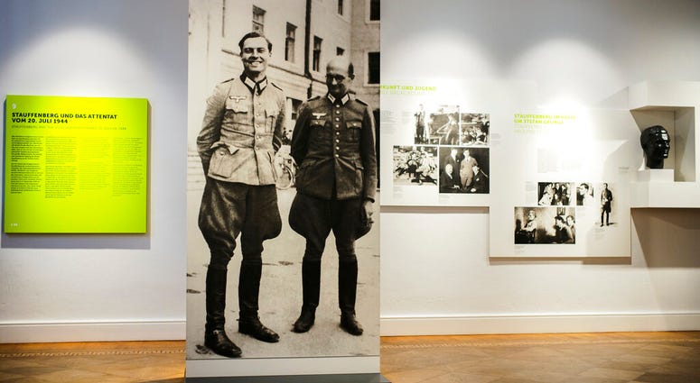 In this Friday, July 12, 2019 photo a picture of Claus Schenk Graf von Stauffenberg, left, and Albrecht Ritter Merz von Quirnheim is displayed a the exhibition at the German Resistance Memorial Center inside the Bendlerblock building of the defensive mini