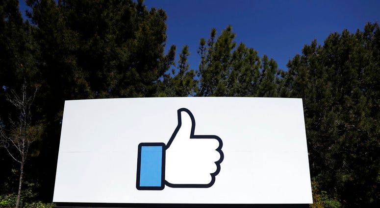 This March 28, 2018, file photo shows the Facebook logo at the company's headquarters in Menlo Park, Calif. (AP Photo/Marcio Jose Sanchez, File)