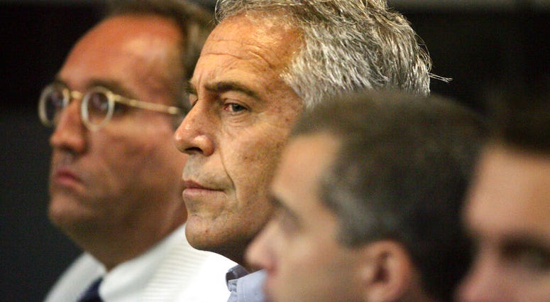 FILE - In this July 30, 2008, file photo, Jeffrey Epstein, center, appears in court in West Palm Beach, Fla. Federal prosecutors, preparing for a bail fight Monday, July 15, 2019, say evidence against Epstein is growing “stronger by the day” after several