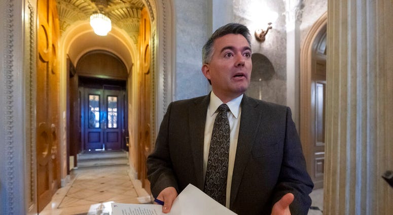 FILE - In this Dec. 31, 2018, file photo, Sen. Cory Gardner, R-Colo., arrives at the Senate Chamber for an abbreviated pro-forma session at the Capitol in Washington. The headquarters of the U.S. government's largest land agency will move from the nation'