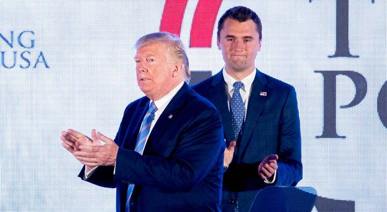 President Donald Trump is joined on stage with Turning Point USA Founder Charlie Kirk as he finishes speaking at Turning Point USA Teen Student Action Summit at the Marriott Marquis in Washington, Tuesday, July 23, 2019. (AP Photo/Andrew Harnik)