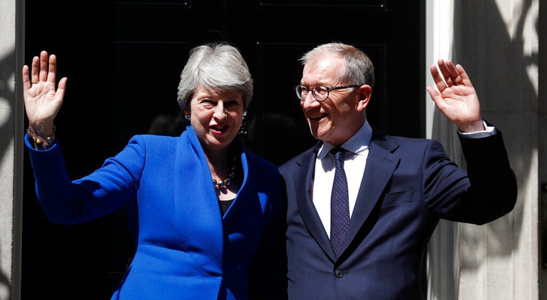 Britain's Prime Minister Theresa May and her husband Philip waves from the steps of 10 Downing Street, London. (AP Photo/Frank Augstein) Britain's Prime Minister Theresa May and her husband Philip waves from the steps of 10 Downing Street, London. (AP Photo/Frank Augstein)