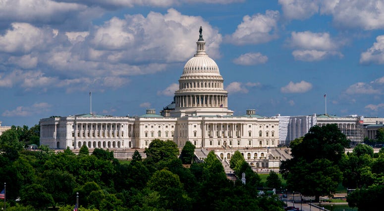 FILE - In this June 20, 2019, file photo, the Capitol is seen from the roof of the Canadian Embassy in Washington. America’s much-maligned health care system is covering more people than ever, a fact lost on many of the 2020 presidential candidates, who k