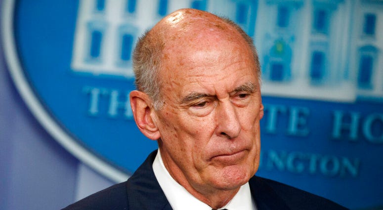 FILE - In this Aug. 2, 2018, file photo, Director of National Intelligence Dan Coats listens during a daily press briefing at the White House in Washington. Coats is to resign in days, after a two-year tenure marked by President Donald Trump's clashes wit