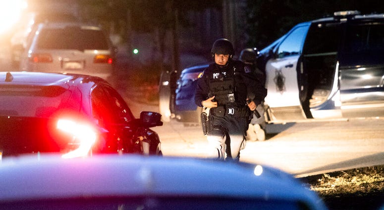 Police work a scene after a deadly shooting at the Gilroy Garlic Festival in Gilroy, Calif., Sunday, July 28, 2019. (AP Photo/Noah Berger)