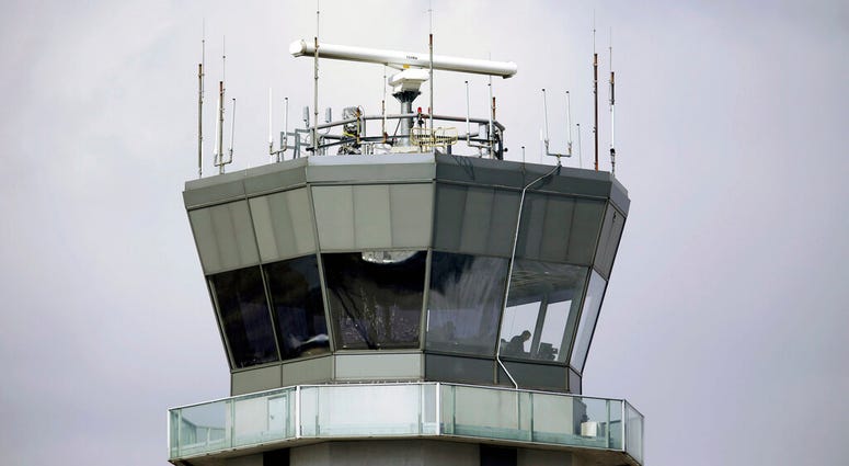 FILE - This March 12, 2013 photo shows the air traffic control tower at Chicago's Midway International Airport. The Department of Homeland Security plans to issue a security alert Tuesday for small planes, warning that modern flight systems are vulnerable