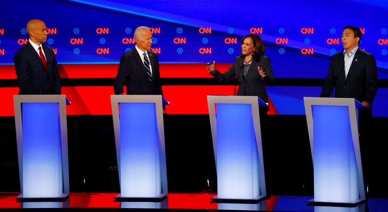 Sen. Cory Booker, D-N.J., former Vice President Joe Biden, Sen. Kamala Harris, D-Calif., and Andrew Yang participate in the second of two Democratic presidential primary debates hosted by CNN Wednesday, July 31, 2019, in Detroit. (AP Photo/Paul Sancya)