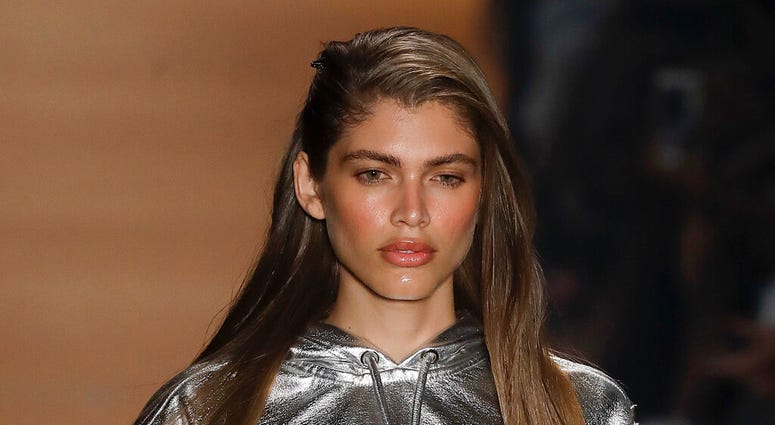 FILE - In this March 16, 2017, file photo Brazilian transgender model Valentina Sampaio wears a creation from the Amir Slama collection during Sao Paulo Fashion Week in Sao Paulo, Brazil. Sampaio has become the first openly transgender model hired by Vict