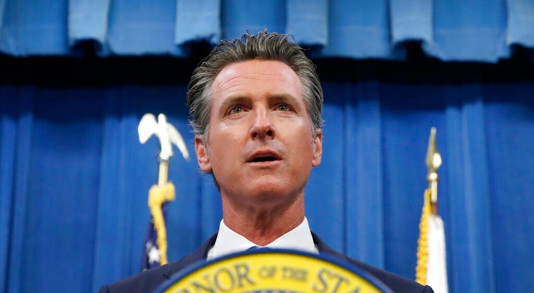 FILE -- In this July 23, 2019 file photo is California Gov. Gavin Newsom during a news conference in Sacramento, Calif. The Trump campaign and Republican Party have sued California over a new law requiring presidential candidates to release their tax retu