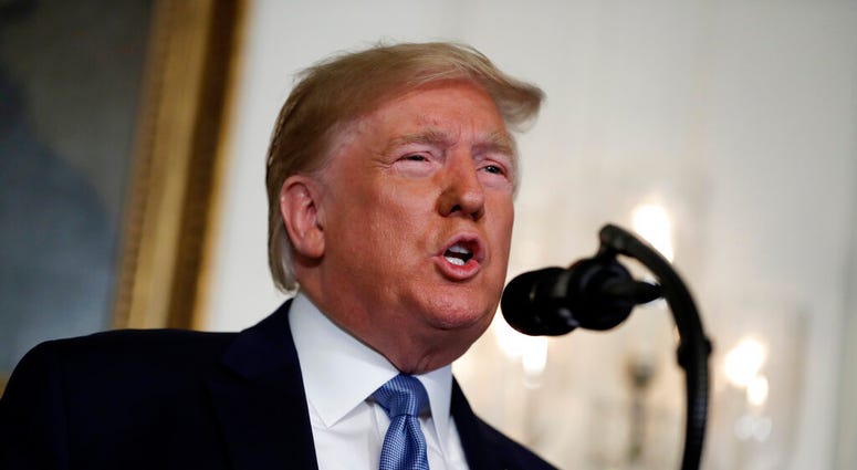 In this Aug. 5, 2019, photo, President Donald Trump speaks about the mass shootings in El Paso, Texas and Dayton, Ohio, in the Diplomatic Reception Room of the White House in Washington. (AP Photo/Evan Vucci)