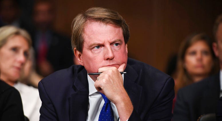 FILE - In this Sept. 27, 2018, file photo, then-White House counsel Don McGahn listens as Supreme court nominee Brett Kavanaugh testifies before the Senate Judiciary Committee on Capitol Hill in Washington. House Speaker Nancy Pelosi says the House Judici