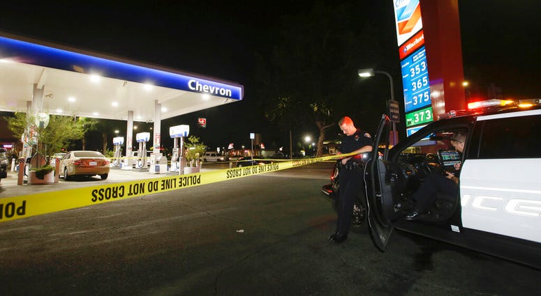 Garden Grove police stand watch at the scene of a stabbing in Garden Grove, Calif., Wednesday, Aug. 7, 2019. (AP Photo/Alex Gallardo)