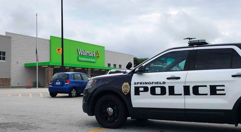 Springfield police respond to a Walmart in Springfield, Mo., Thursday afternoon, Aug. 8, 2019, after reports of a man with a weapon in the store. Police in Springfield, Missouri, say they have arrested an armed man who showed up the Walmart store wearing