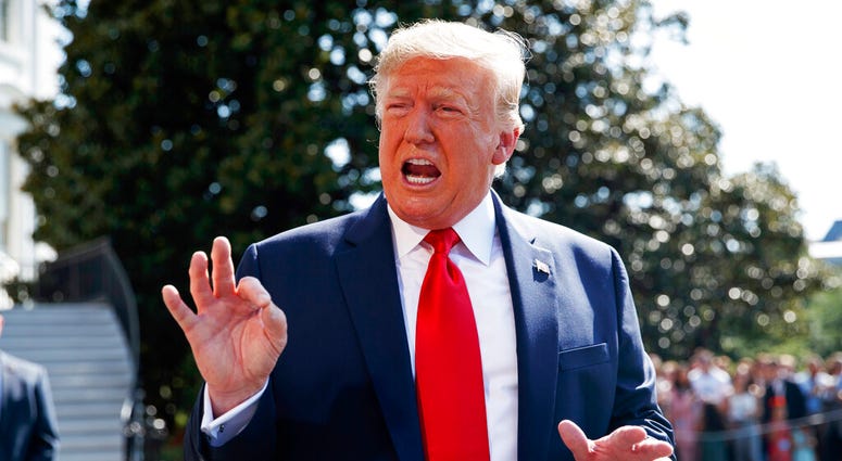 President Donald Trump talks to reporters on the South Lawn of the White House, Friday, Aug. 9, 2019, in Washington, as he prepares to leave Washington for his annual August holiday at his New Jersey golf club. (AP Photo/Evan Vucci)