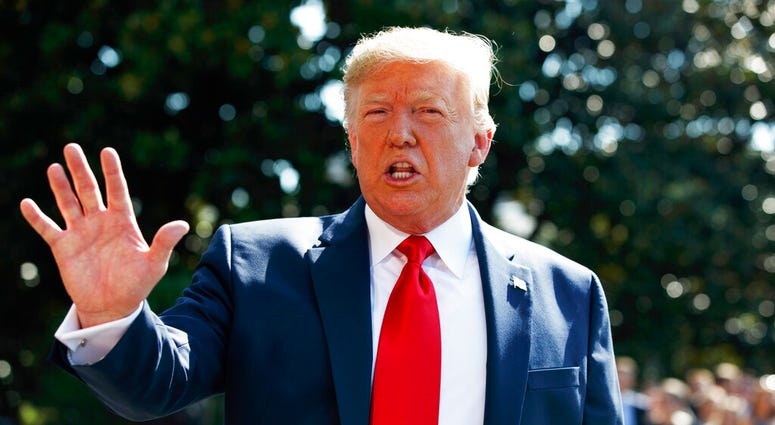 President Donald Trump talks to reporters on the South Lawn of the White House, Friday, Aug. 9, 2019, in Washington, as he prepares to leave Washington for his annual August holiday at his New Jersey golf club. (AP Photo/Evan Vucci)