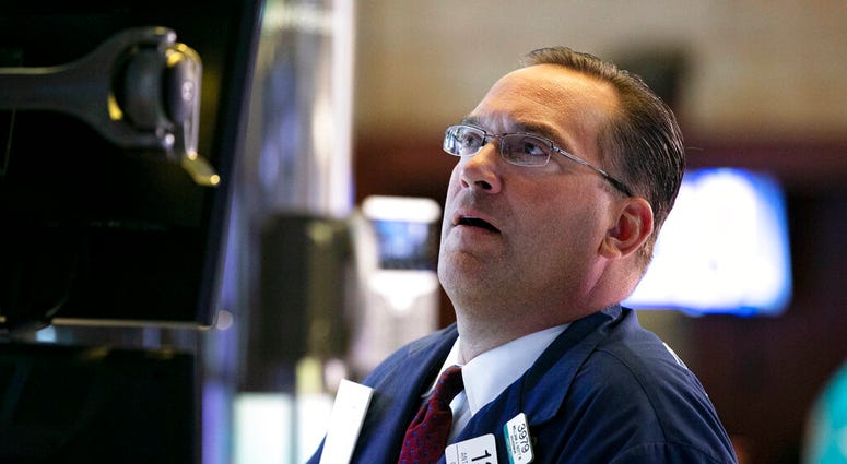 Specialist Anthony Matsic works at his post on the floor of the New York Stock Exchange, Monday, Aug. 12, 2019. (AP Photo/Richard Drew)