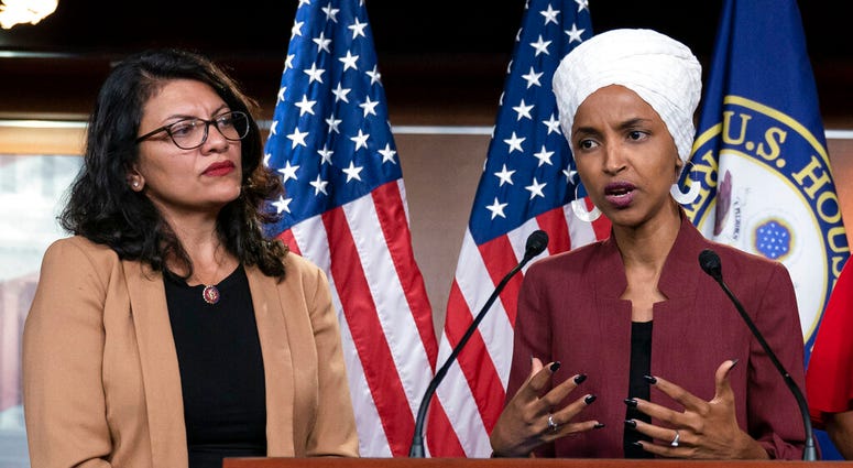 In this July 15, 2019, file photo, U.S. Rep. Ilhan Omar, D-Minn, right, speaks, as U.S. Rep. Rashida Tlaib, D-Mich. listens, during a news conference at the Capitol in Washington. (AP Photo/J. Scott Applewhite, File)