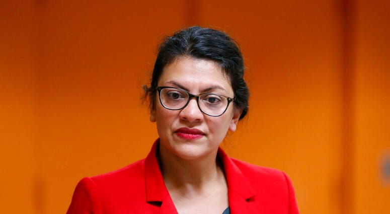 U.S. Rep. Rashida Tlaib, D-Mich., listens to a question from a constituent in Wixom, Mich., Thursday, Aug. 15, 2019. (AP Photo/Paul Sancya)