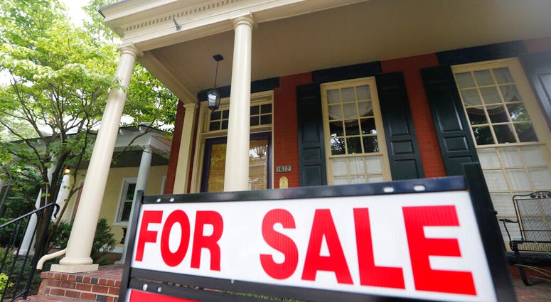 In this Aug. 16, 2019, photo a for sale signs beckon buyers to homes along Park Avenue in Richmond, Va. On Thursday, Aug. 22, Freddie Mac reports on this week’s average U.S. mortgage rates. (AP Photo/Steve Helber)
