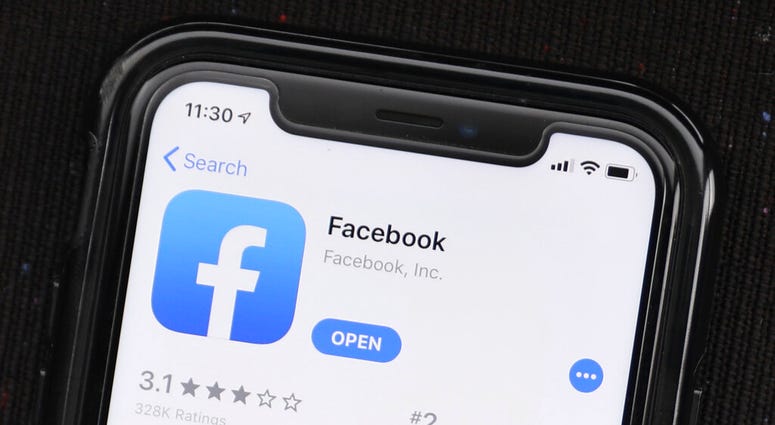FILE - In this July 30, 2019, file photo, the social media application, Facebook is displayed on Apple's App Store. Facebook is launching a long-promised tool that lets users block the social network from gathering information about them on outside websit