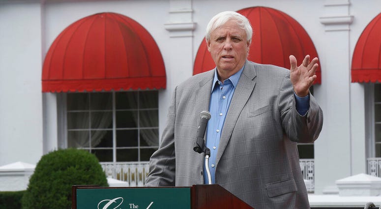 FILE - In this July 7, 2016 file photo Jim Justice, owner of The Greenbrier Resort, speaks to members of Team Greenbrier during a news conference in front of the hotel in White Sulphur Springs W.Va.
