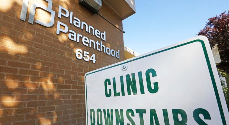 A sign is displayed at Planned Parenthood of Utah Wednesday, Aug. 21, 2019, in Salt Lake City. (AP Photo/Rick Bowmer)