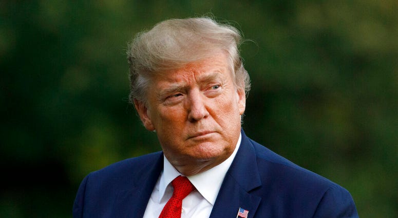 In this Aug. 21, 2019 photo, President Donald Trump arrives at the White House in Washington, as he returns from Louisville, Ky. (AP Photo/Carolyn Kaster)