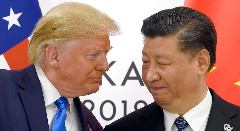 FILE - In this June 29, 2019, file photo, President Donald Trump, left, meets with Chinese President Xi Jinping during a meeting on the sidelines of the G-20 summit in Osaka, Japan.