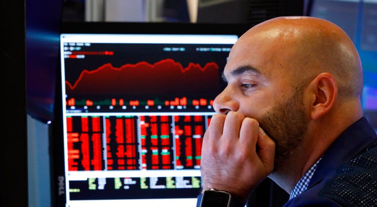 Trader Fred DeMarco works on the floor of the New York Stock Exchange, Friday, Aug. 23, 2019. (AP Photo/Richard Drew)