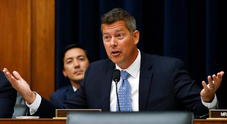 FILE - In this July 18, 2018, file photo, Rep. Sean Duffy, R-Wisc., asks a question of Federal Reserve Board Chair Jerome Powell during a House Committee on Financial Services hearing on Capitol Hill in Washington.