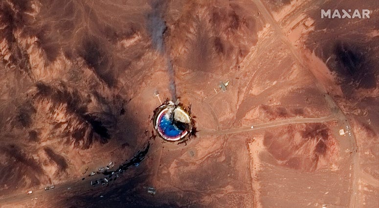 This satellite image from Maxar Technologies shows a fire at a rocket launch pad at the Imam Khomeini Space Center in Iran's Semnan province, Thursday, Aug. 29, 2019. Satellite images released Thursday show the smoldering remains of a rocket at a Iran spa