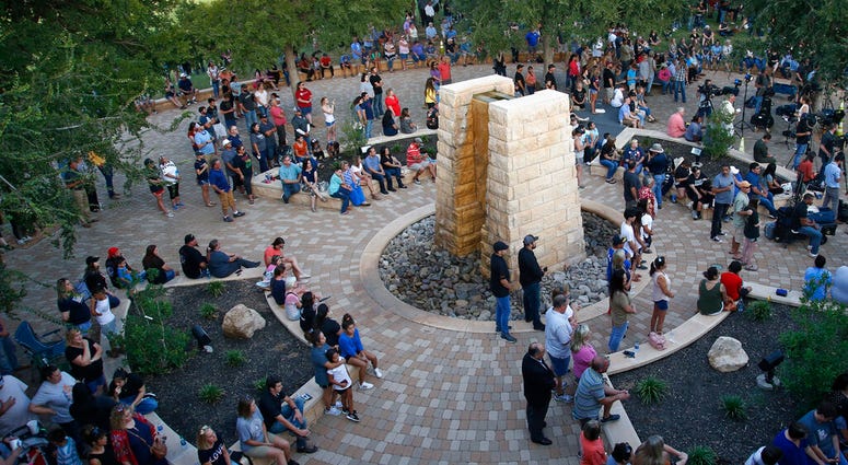 People attend a memorial service for the victims of a shooting spree the day before, Sunday, Sept. 1, 2019, in Odessa, Texas. (AP Photo/Sue Ogrocki)