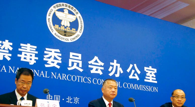 Liu Yuejin, center, the vice commissioner of China's National Narcotics Control Commission, speaks during a press conference in Beijing, Tuesday, Sept. 3, 2019.