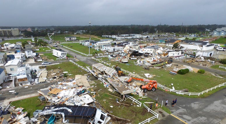 Emerald Isle town employees work to clear the road after a tornado hit Emerald Isle N.C. as Hurricane Dorian moved up the East coast on Thursday, Sept. 5, 2019.