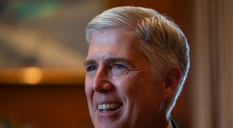 Associate Justice Neil Gorsuch, President Donald Trump's first appointee to the high court, speaks to The Associated Press about events that have influenced his life and the loss of civility in public discourse, in his chambers at the Supreme Court in Was