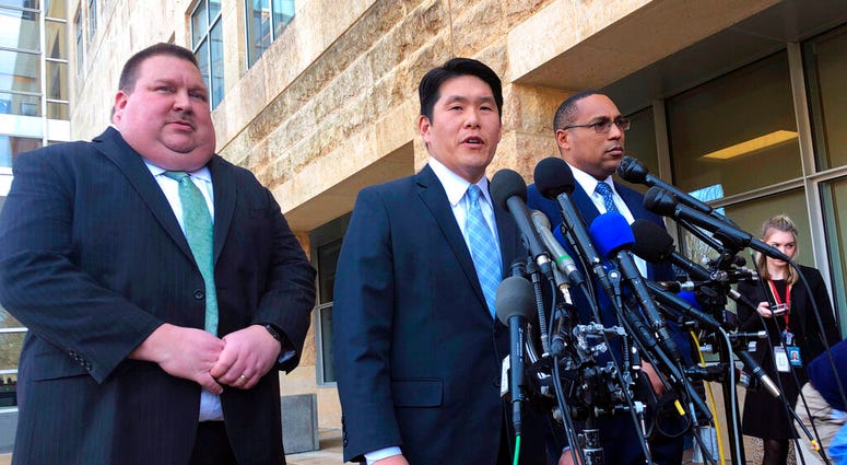 FILE - This Feb. 21, 2019, file photo shows U.S. Attorney Robert Hur, center, of the District of Maryland, speaks as Art Walker, left, special agent from the Coast Guard investigative service, and Gordon Johnson, special agent in charge of the FBI's Balti