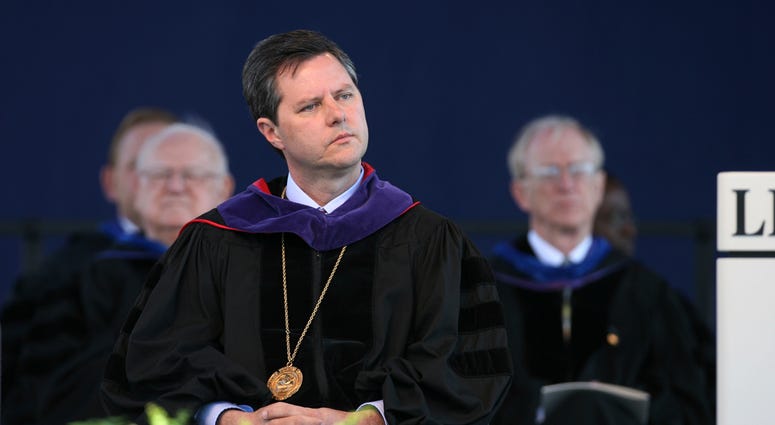 FILE - In this May 19, 2007, file photo, Jerry Falwell, Jr. listens before speaking for the first time as chancellor of Liberty University at the school's graduation ceremony in Lynchburg, Va.