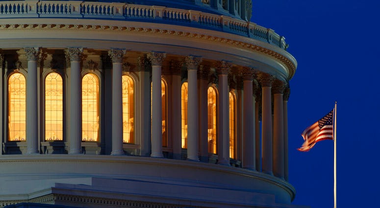 FILE - In this July 16, 2019, file photo an American flag flies on the Capitol Dome in Washington. On Thursday, Sept. 12, the Treasury Department releases federal budget data for August.