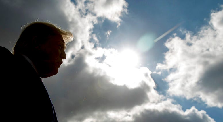 In this Oct. 27, 2018 file photo, President Donald Trump speaks to reporters in Indianapolis. (AP Photo/Andrew Harnik)