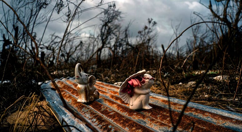 Porcelain figures rest among the remains of a shattered house at the aftermath of Hurricane Dorian in Freetown, Grand Bahama, Bahamas, Friday Sept. 13, 2019. Porcelain figures rest among the remains of a shattered house at the aftermath of Hurricane Dorian in Freetown, Grand Bahama, Bahamas, Friday Sept. 13, 2019.